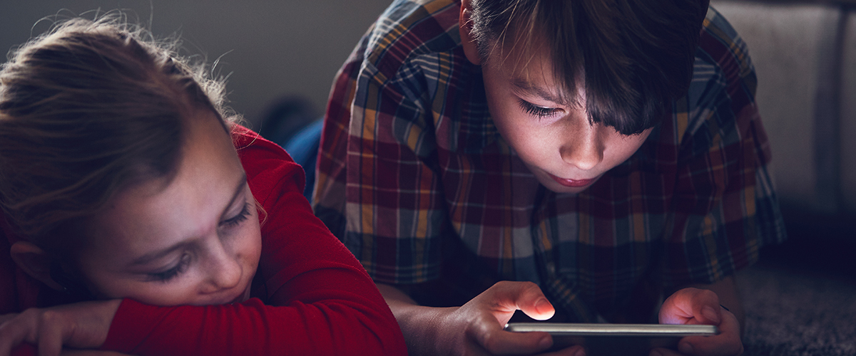Girl and boy with their smart phones