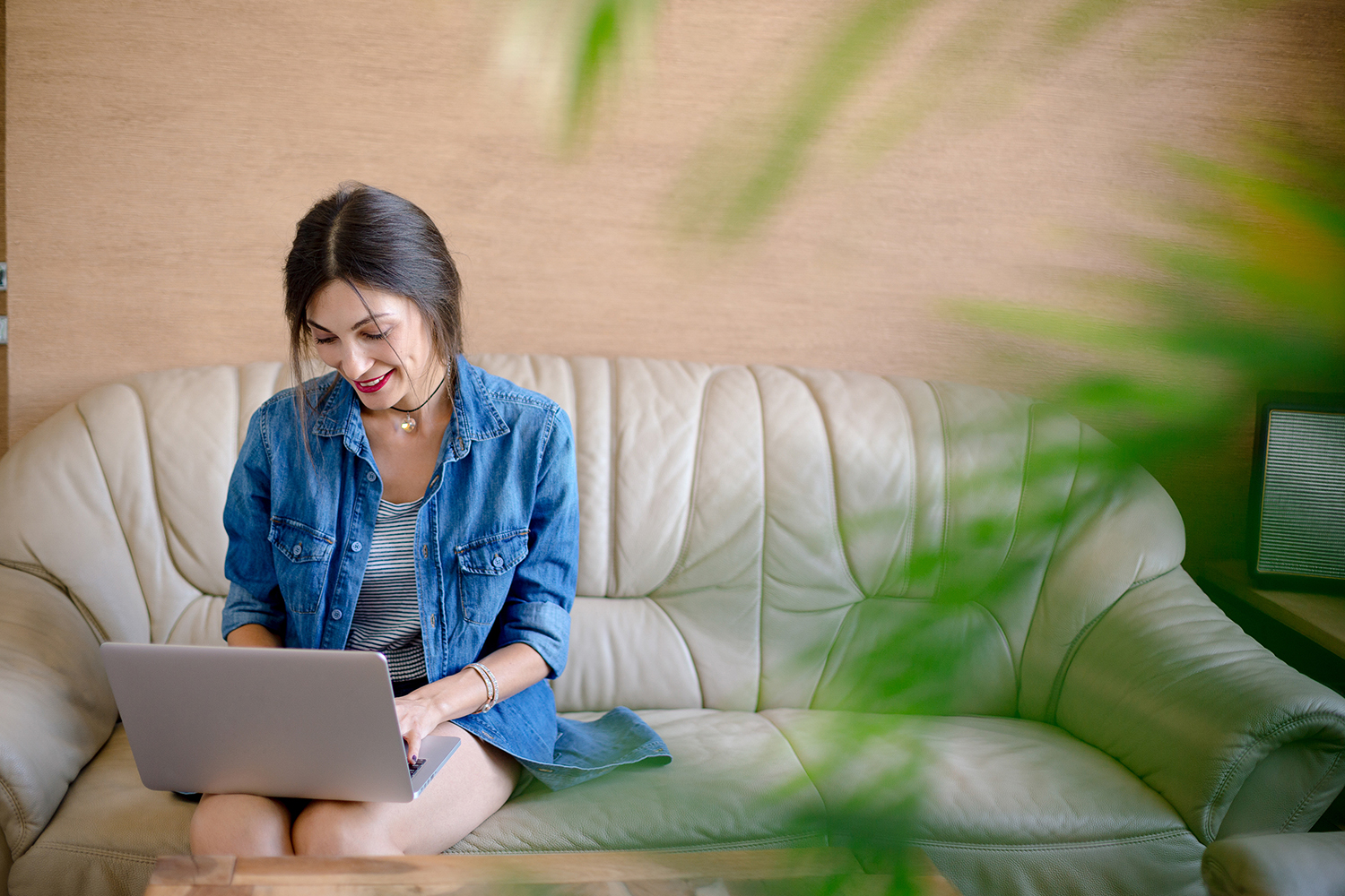 Smiling beautiful woman working on laptop